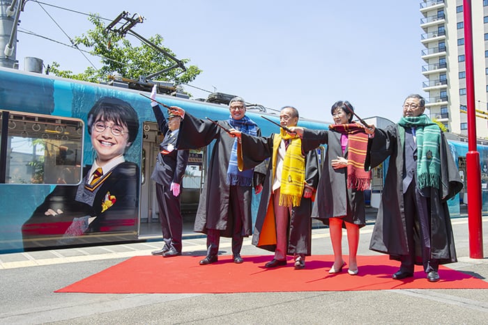 Officials celebrating the first departure of the Studio Tour Tokyo Express